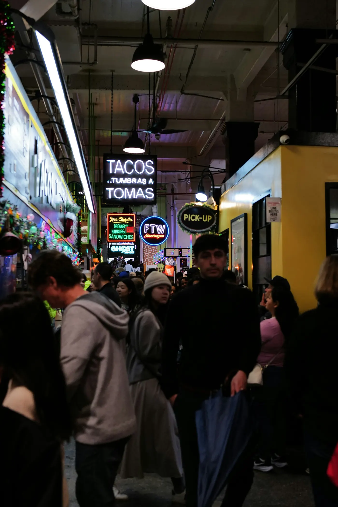 A busy food hall at night