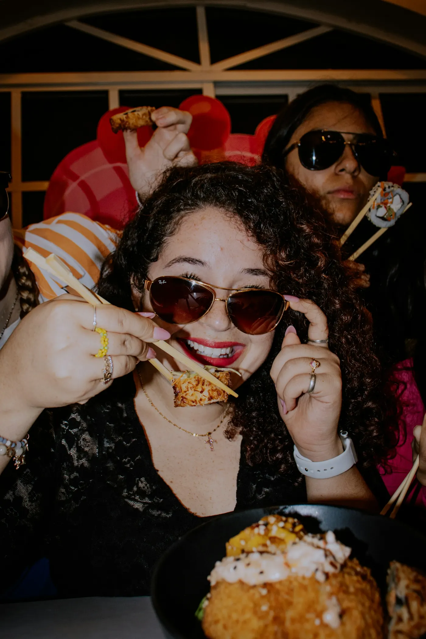 Guests at a party, sunglasses on